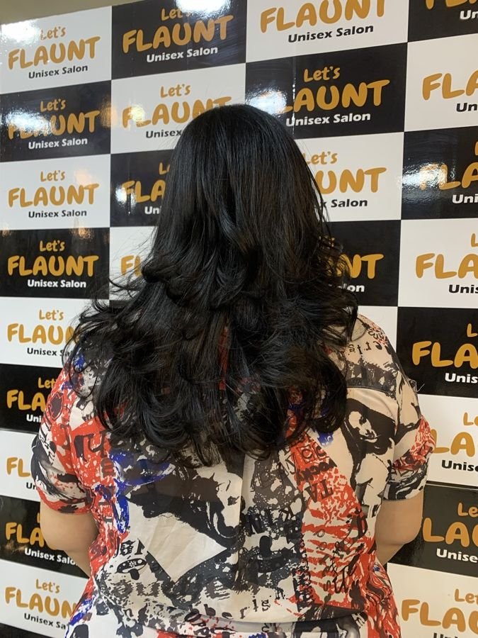 Healthy layered hair styled at Let's Flaunt salon